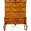 This George I walnut and laburnum inlaid chest on stand is estimate to make £300-£500