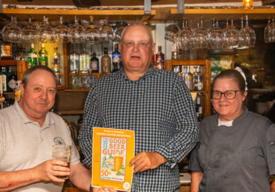 Ian Turner (left), chairman of the Salisbury & S. Wilts branch of CAMRA, presents a Good Beer Guide certificate to Martin Crane, landlord of The Pheasant, Salisbury, and his wife Julie. Photograph: Roger Braddick