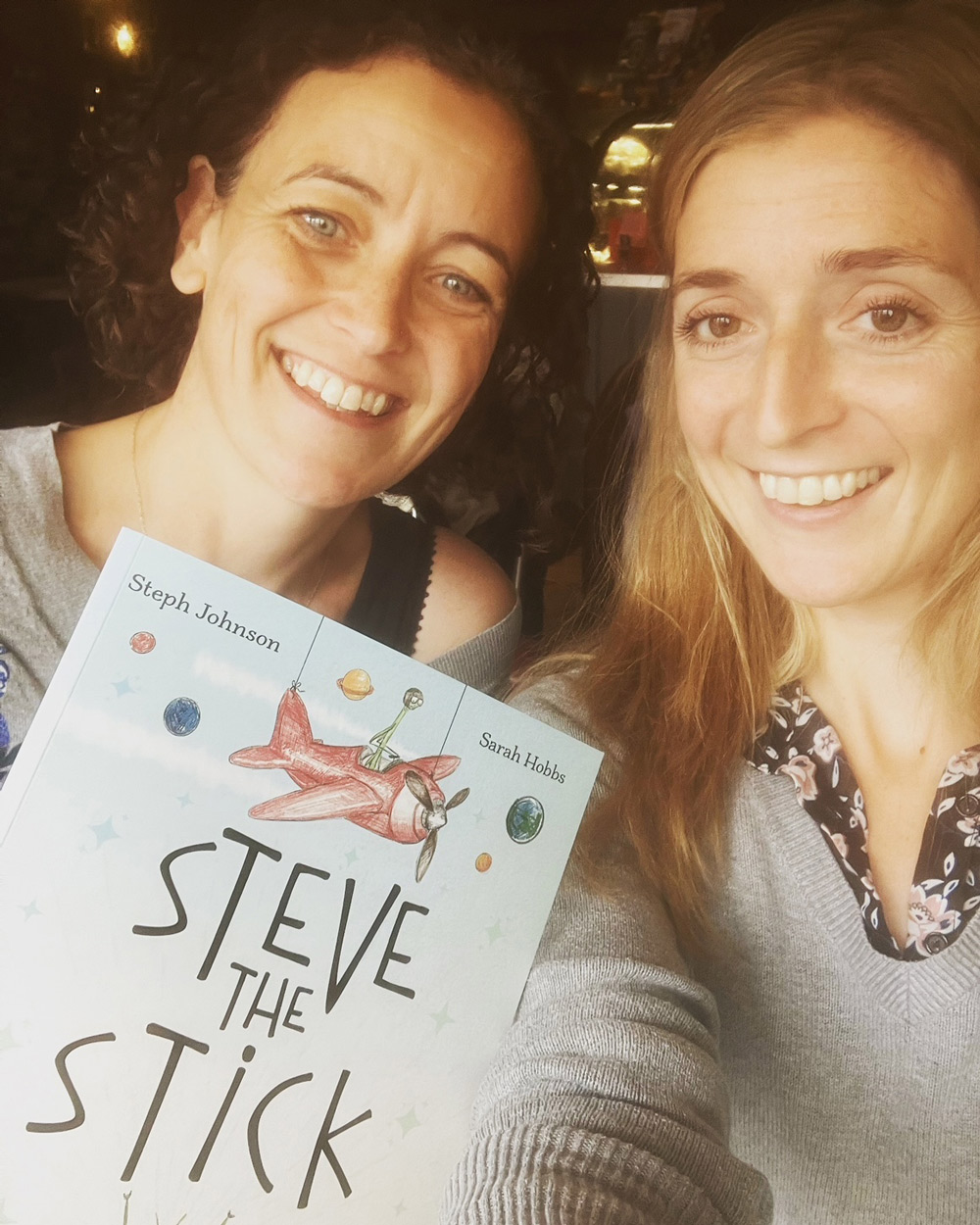 Sarah Hobbs (left) and Steph Johnson (right) hold a copy of Steve the Stick