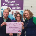 Wessex Community Action chief executive Amber Skyring, right, presents a voucher to South Wilts Mencap trustees Linda Lane and Nigel Afford. All survey respondents were entered into a draw