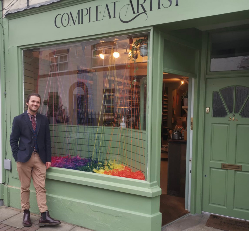 Pierre stands outside the shop he opened in March
