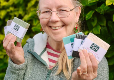Roxy Eastland holding soaps from her Down to Earth range