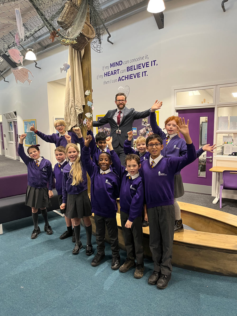 Headteacher, Ollie Martindale, celebrates with pupils at St Peters CoE Primary