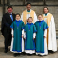 The new girl choristers with L-R Clive Marriott, Salisbury Cathedral School Headmaster, The Dean of Salisbury and Canon Anna Macham, Canon Precentor. Credit: Finnbarr Webster