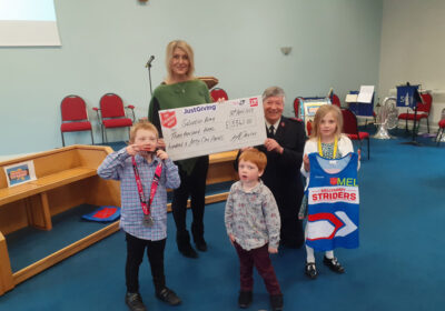 Mel Davies with captain Martin Davison and children from the church looking at the London marathon medal and ‘Sally Army Striders’ running vest. (Permission has been given by the parents for the publication of this picture)
