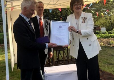 Nick Andrew receives the award from Sarah Troughton, Lord Lieutenant of Wiltshire;