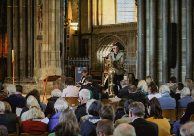 Poet Martin Figura reading at the We Reflect service, held at Salisbury Cathedral in March 2022