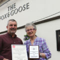 Keith Smith, landlord of The Fox & Goose, receives his awards from Derek Blackshaw’s widow Sue