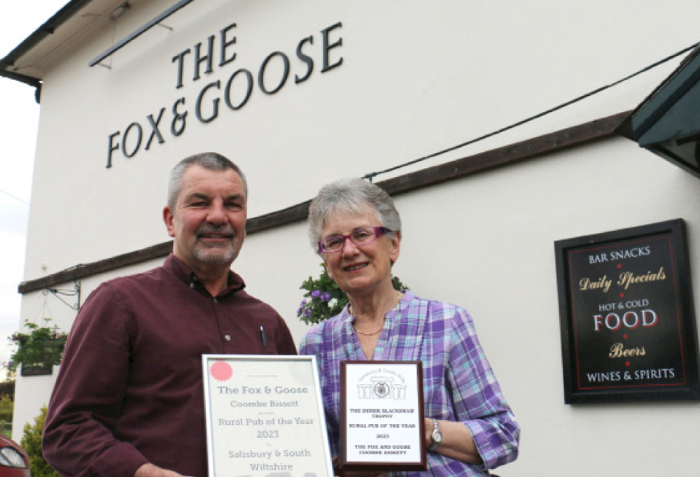 Keith Smith, landlord of The Fox & Goose, receives his awards from Derek Blackshaw’s widow Sue