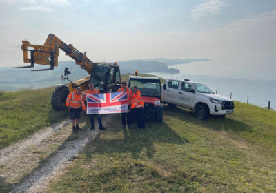 The Landmarc team raising the flag at different locations at Lulworth Ranges
