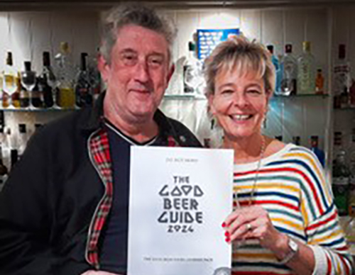 Lorna Janse van Vuuren from The Bridge Inn receives a Good Beer Guide certificate from Chris White, chair of Salisbury & South Wilts Camra. Picture: Steve Stringer