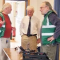 Fordingbridge Repair Café project lead Dave Sanders, left, with MP Sir Desmond Swayne, centre, and repairer Steve Tonkin