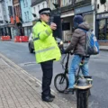 Police issuing advice t a cyclist in Fisherton Street after reports of people not obeying the one-way system. Picture: Wiltshire Police