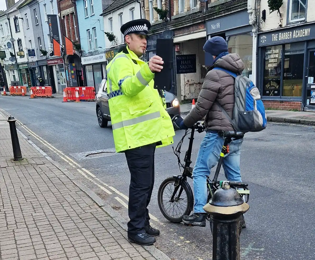 Police issuing advice t a cyclist in Fisherton Street after reports of people not obeying the one-way system. Picture: Wiltshire Police