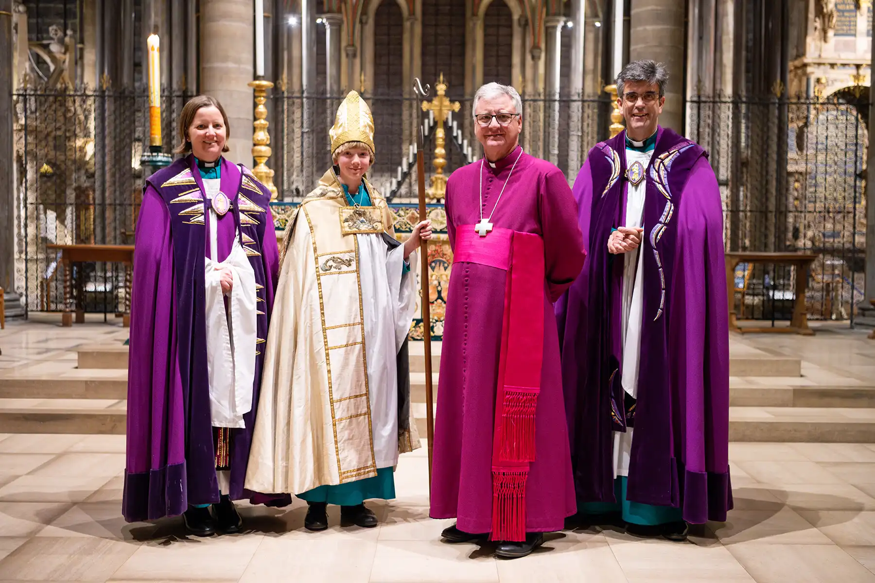 Chorister Bishop Harry Mills with the Salisbury Cathedral Canon Precentor, left, the Bishop of Salisbury and Dean of Salisbury, right. Picture: Finnbarr Webster