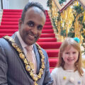 Cllr Hoque and Martha, winner of the Christmas card competition.