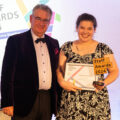 Speech therapist Lizzie Goodyear picking up her award