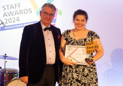 Speech therapist Lizzie Goodyear picking up her award