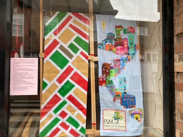 The displays initially featured images relating to the town before being replaced with festive artwork created by school children Picture: Andy Wilson