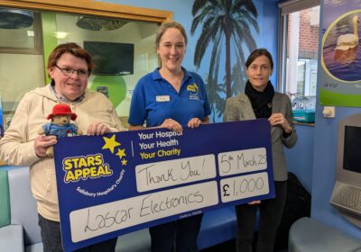 Staff handing over the cheque Picture: Stars Appeal/ Lascar Electronics