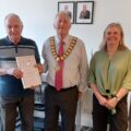 Anthony being presented with his certificate by Mayor Owen White and Coach Rosie Picture: Read Easy