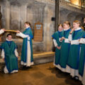 Senior choristers bump Jessica with a bible in the traditional ceremony Picture: Salisbury Cathedral/Finnbarr Webster