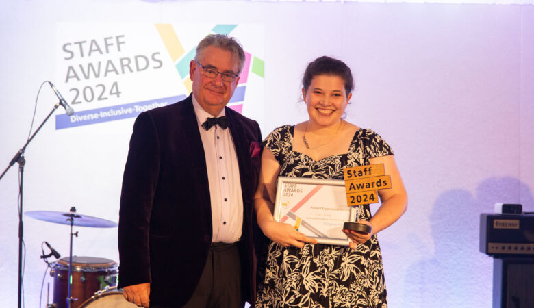Speech therapist Lizzie Goodyear being presented with the Patient Experience Award by Stephen Oxley, Stars Appeal fundraising chairman at the 2024 Staff Awards ceremony Picture: Salisbury NHS Foundation Trust