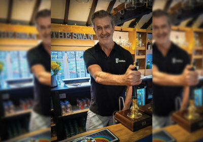Rupert Everett serving behind the bar of The Swan wearing his CAMRA t-shirt Picture: Salisbury CAMRA