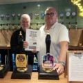 Keith Foster, Good Beer Guide co-ordinator for Salisbury & South Wilts CAMRA, presenting Coach & Horses landlord Chris Meaker with his certificate Picture: Salisbury CAMRA