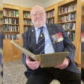 Douglas Parish looking over diary extracts from 1944 Picture: RNA