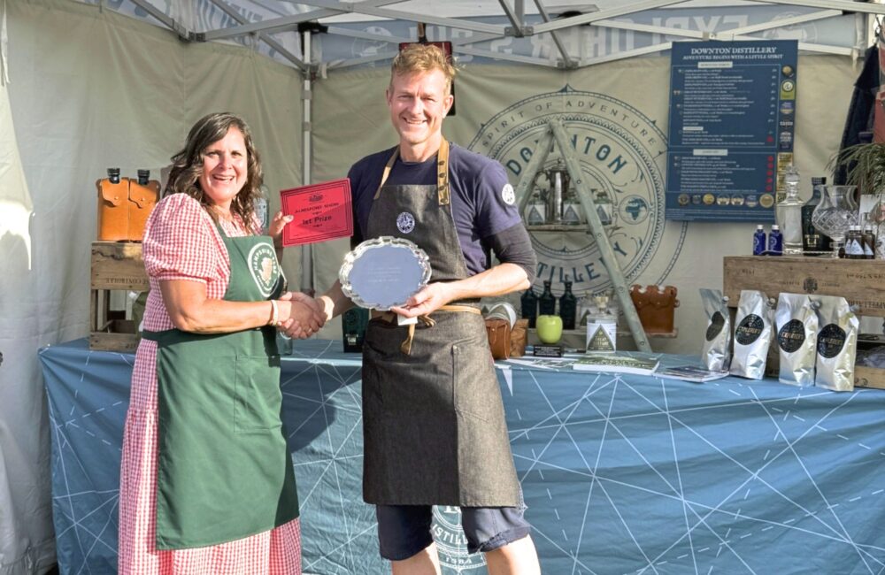 Hugh Anderson from Downton Distillery being presented with the award by Natasha Dochniak of Hampshire Fare Picture: Downton Distillery