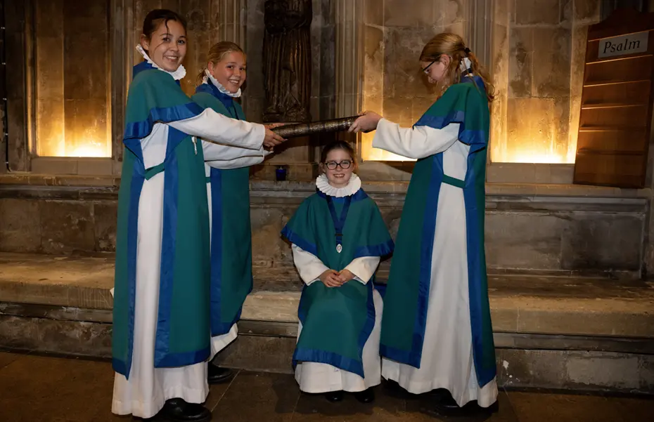 Senior choristers bump Arabella Luck into the choir Picture: Finnbarr Webster