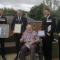 D-Day veteran Commander Douglas Parish celebrates his 100th birthday at Braemar Lodge care home in Salisbury in the company of uniformed Royal Navy representatives Picture: Braemar Lodge
