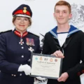 Charlie being presented with a certificate honourin his new role by Dame Sarah Troughton Picture: Salisbury Sea Cadets
