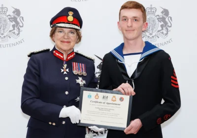 Charlie being presented with a certificate honourin his new role by Dame Sarah Troughton Picture: Salisbury Sea Cadets