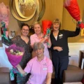 Milford team members celebrating left to right: senior general manager Aga Musial, activities assistant Jane Durran, hospitality services manager Scarlet Leatham and front row activities co-ordinator Gale Louw Picture: Milford House