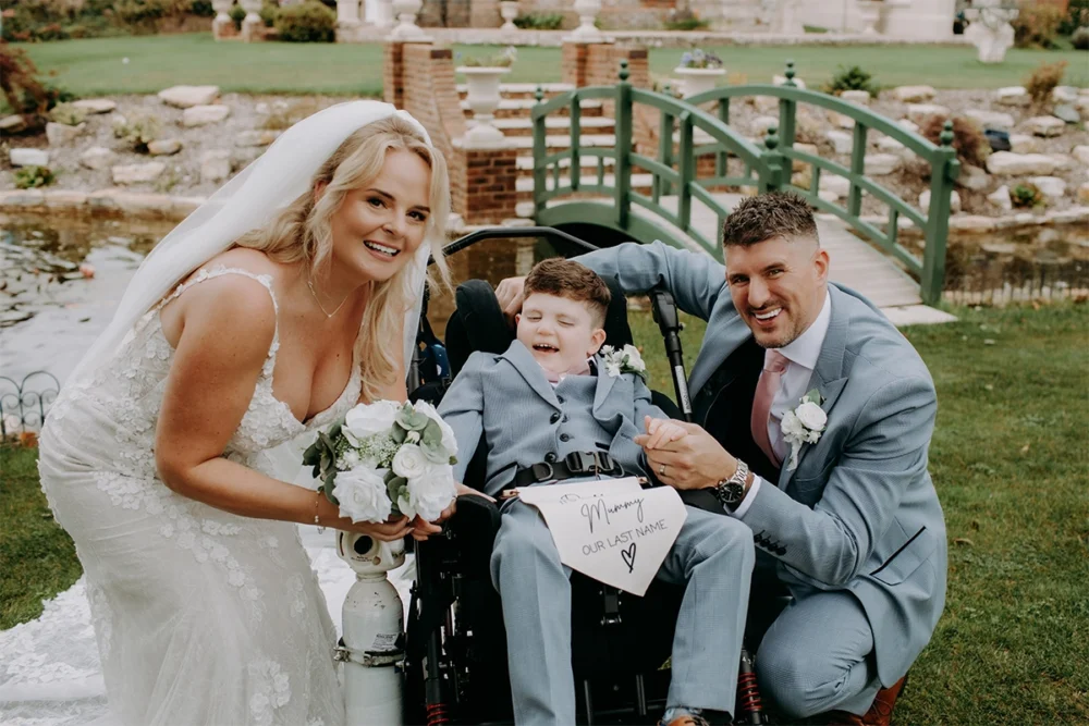 Alfie with mum Charmaine and dad Joe at their wedding Picture: Peter Welland Photography