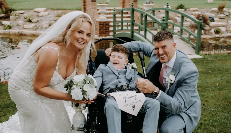 Alfie with mum Charmaine and dad Joe at their wedding Picture: Peter Welland Photography