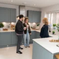 Bellway sales advisor Verity Skene, right, with Sales Manager Emily Putnam and George Putnam in the kitchen of the Scrivener showhome Picture: Bellway