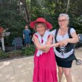Braemar Lodge Waitress Ildiko Fuves, right, and resident Jackie Jilbert enjoy a dance to live music from folk band Maerefolk