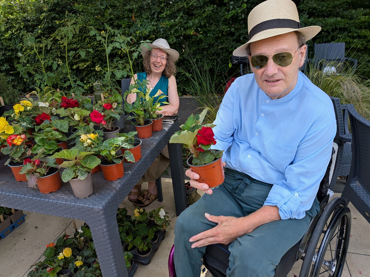 Braemar Lodge gardener Sarah Rideout and resident Anton Prantl working on the plant stall