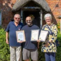 Cuckoo Inn landlord Nik Amplianitis, centre, receives the award from CAMRA Salisbury & South Wiltshire branch regional director Norman Clinnick, and cider champion Jane Foster