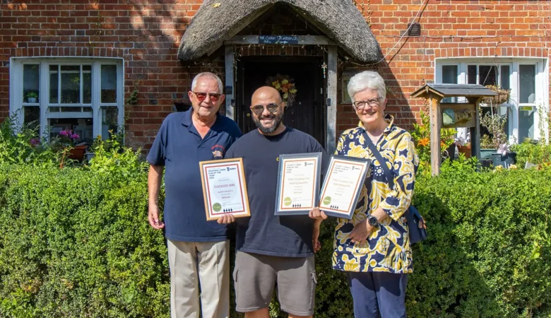 Cuckoo Inn landlord Nik Amplianitis, centre, receives the award from CAMRA Salisbury & South Wiltshire branch regional director Norman Clinnick, and cider champion Jane Foster