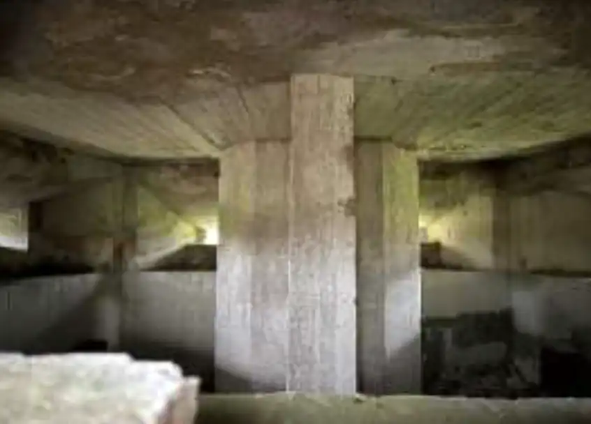 The inside of the pillbox, which is showing signs of wear