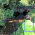 An Environment Agency officer checks water levels