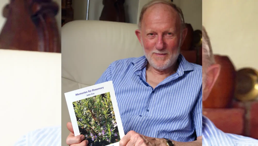 John Cox with his book, Memories for Rosemary