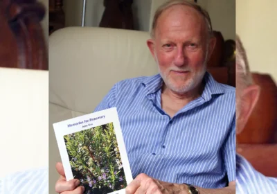 John Cox with his book, Memories for Rosemary