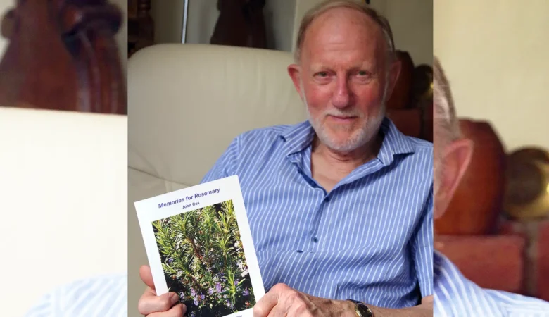 John Cox with his book, Memories for Rosemary