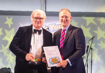 John Gardiner receiving his award from Charity Director of the Stars Appeal, David Coulthard. Picture: Salisbury NHS Foundation Trust