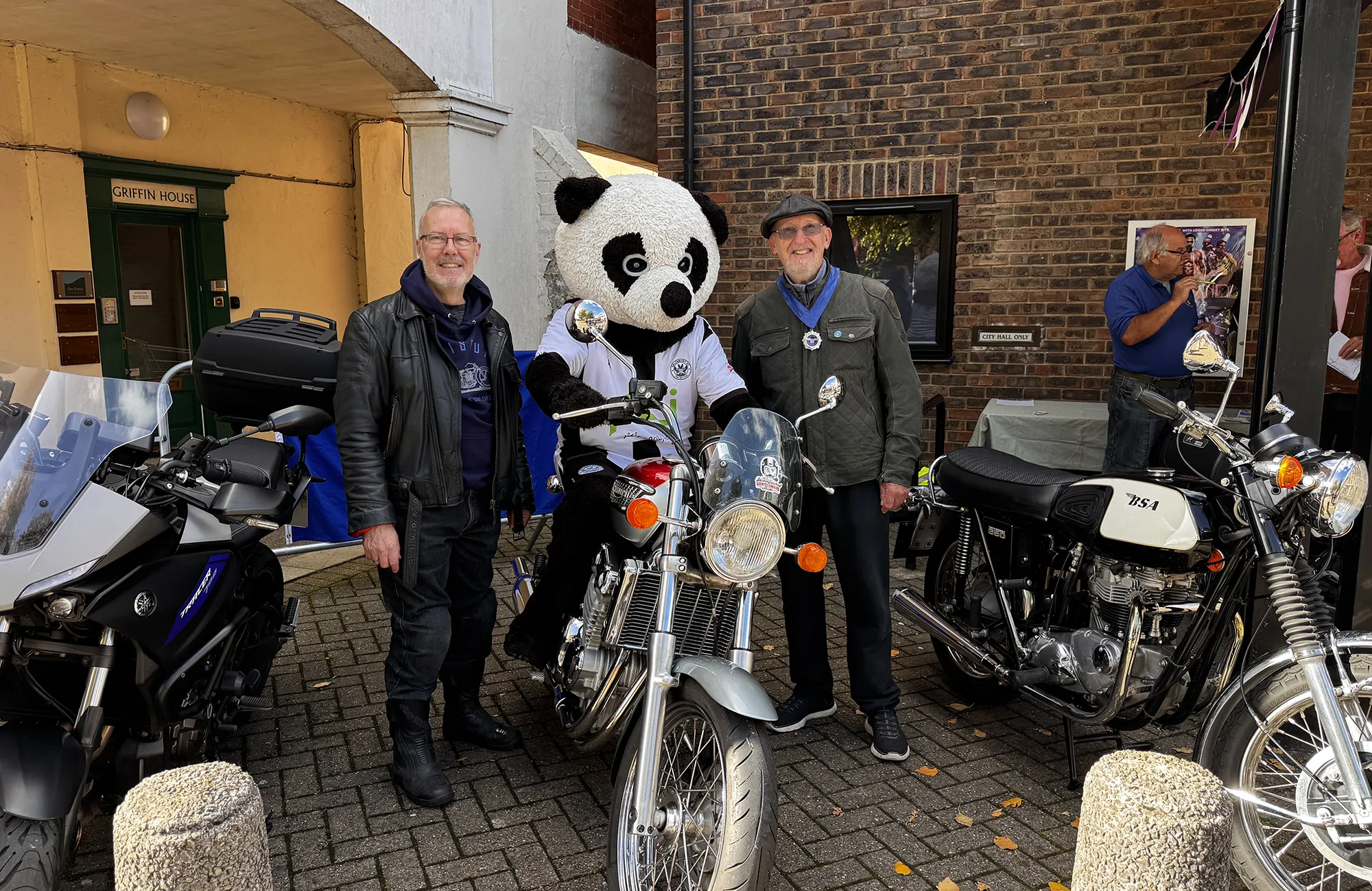Classic motorcycles - and mascot Chalky - welcoming visitors